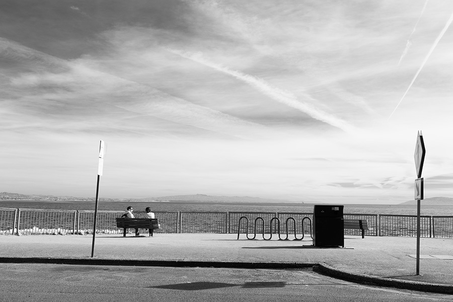 Infrared Photo of Walkway, Fence, Ocean, and Sky.